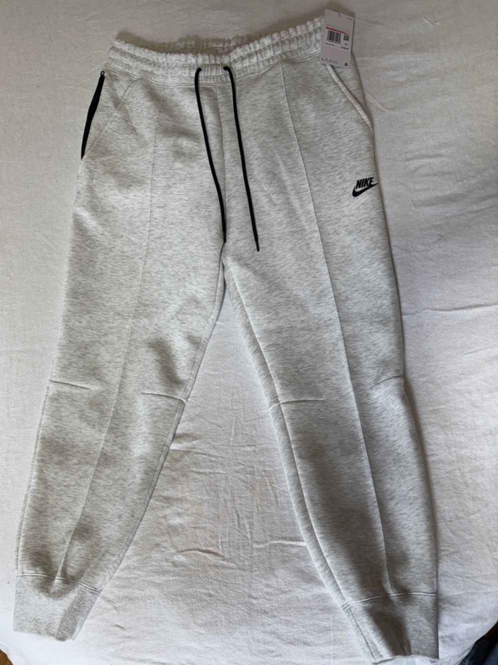 Nike Light Heather Gray Joggers with Black Drawstrings